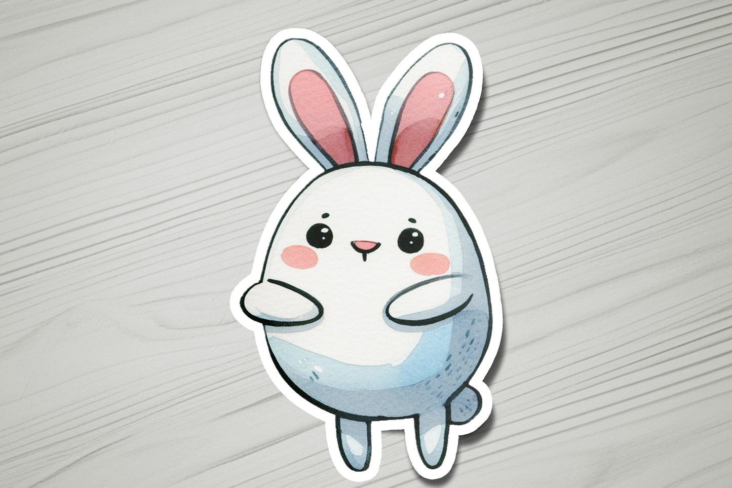 a sticker of a rabbit on a wooden surface