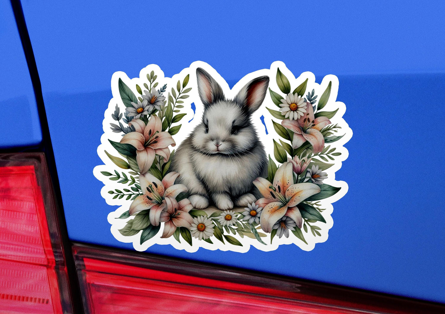 a sticker of a bunny rabbit with flowers