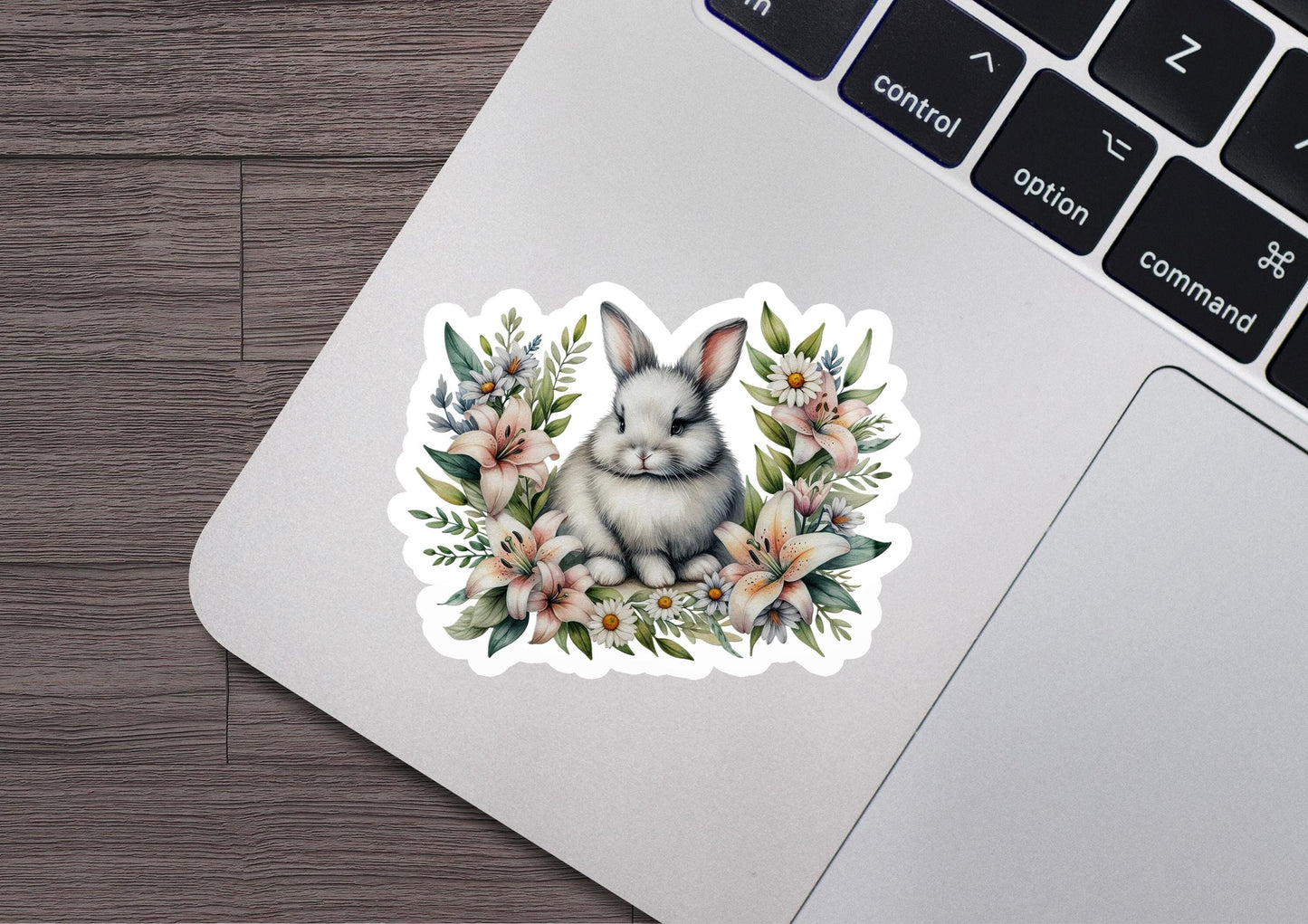 a laptop with a sticker of a rabbit on it