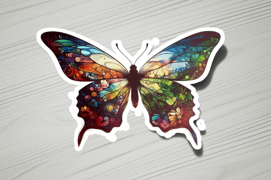 a colorful butterfly sticker sitting on top of a table