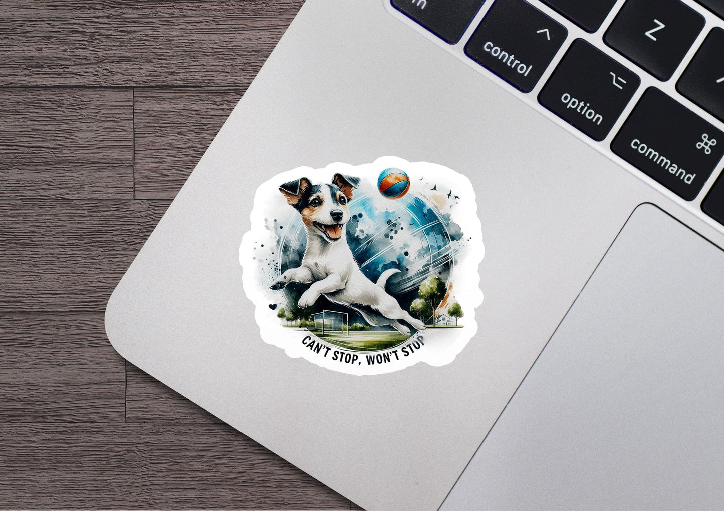 a sticker of a dog playing with a ball