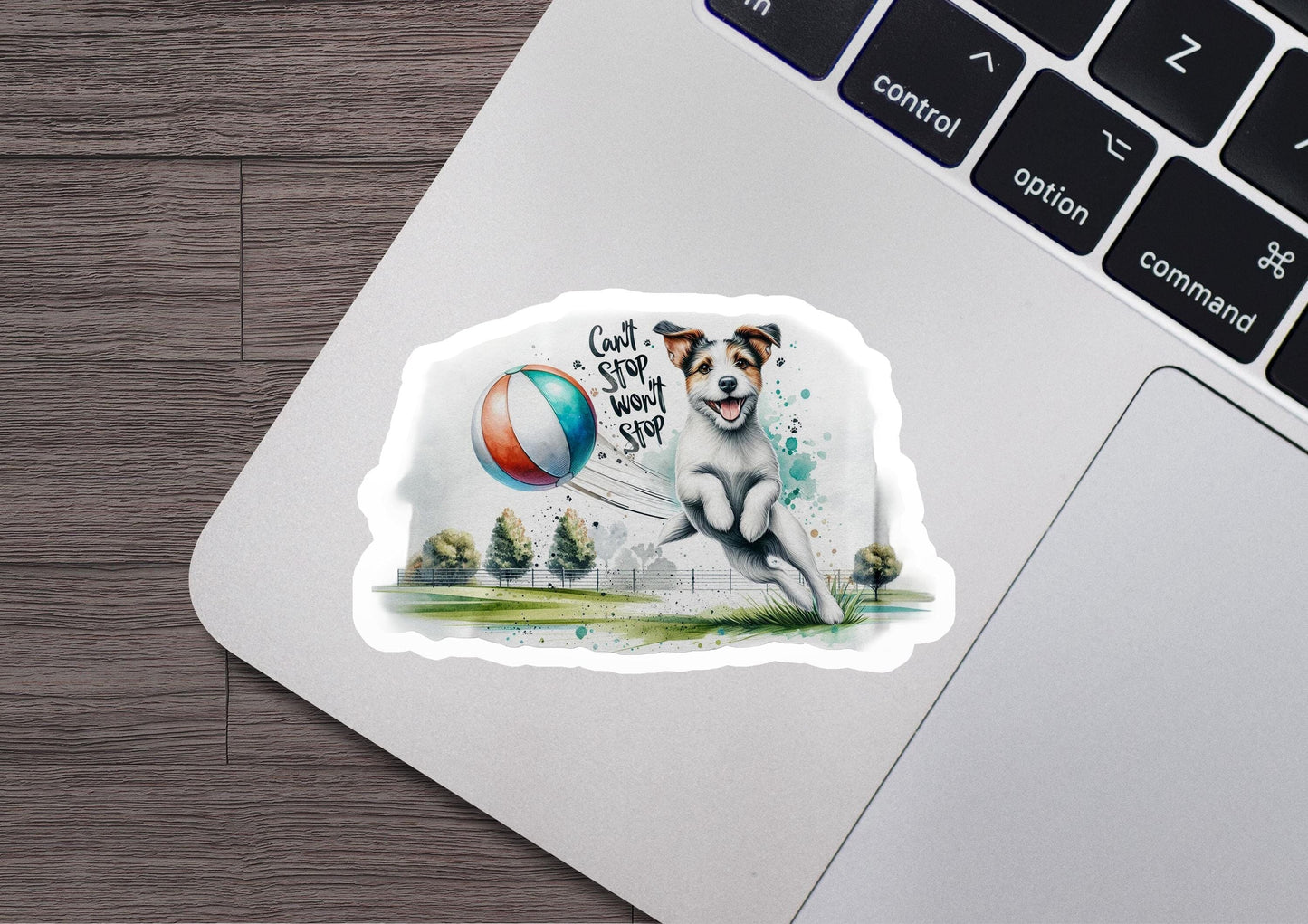 a sticker of a dog playing with a ball