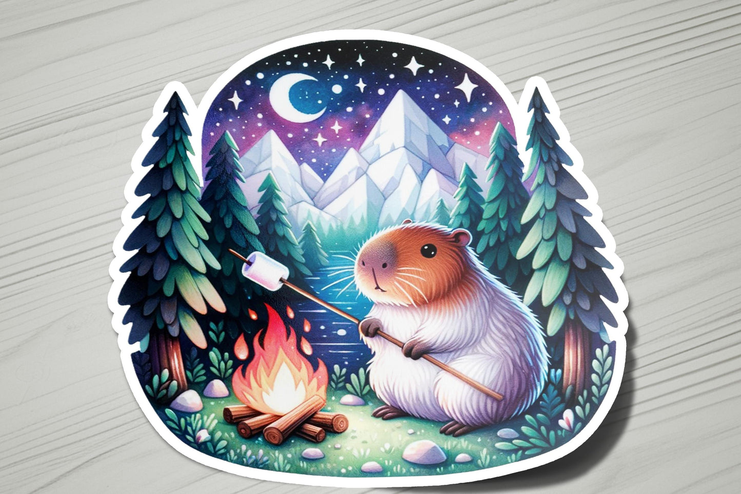 a sticker with a picture of a hamster sitting next to a campfire
