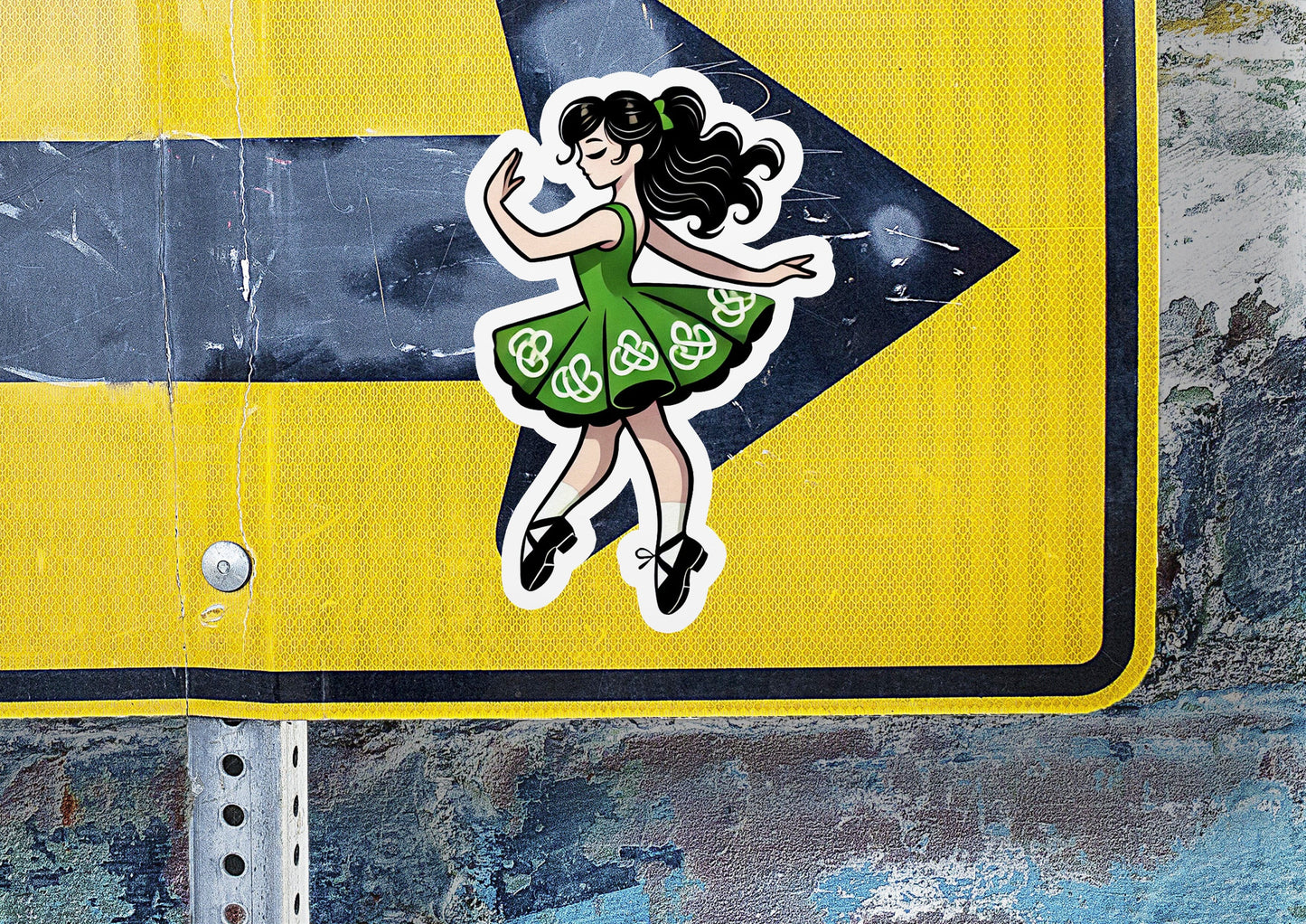 a street sign with a sticker of a woman dancing