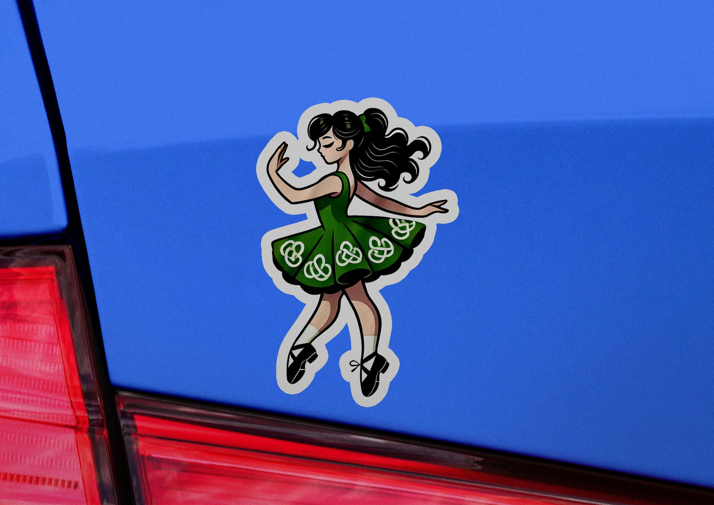 a car with a sticker of a woman in a green dress