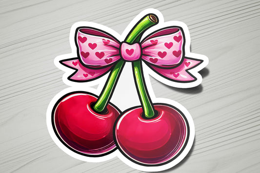 a sticker of two cherries with a bow