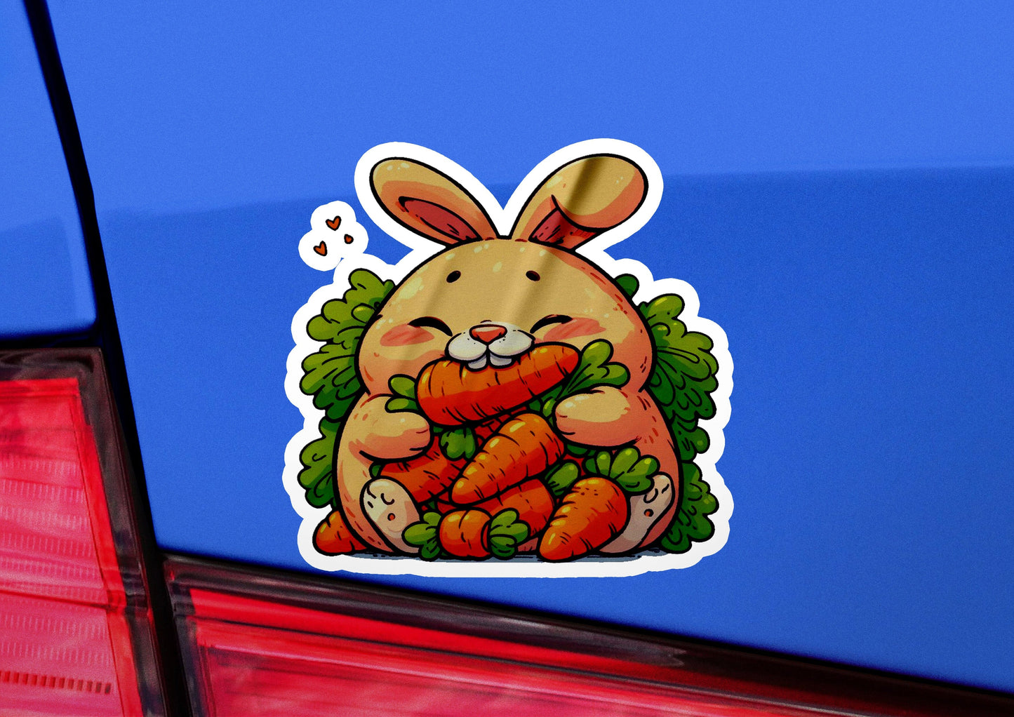 a sticker of a rabbit holding a carrot