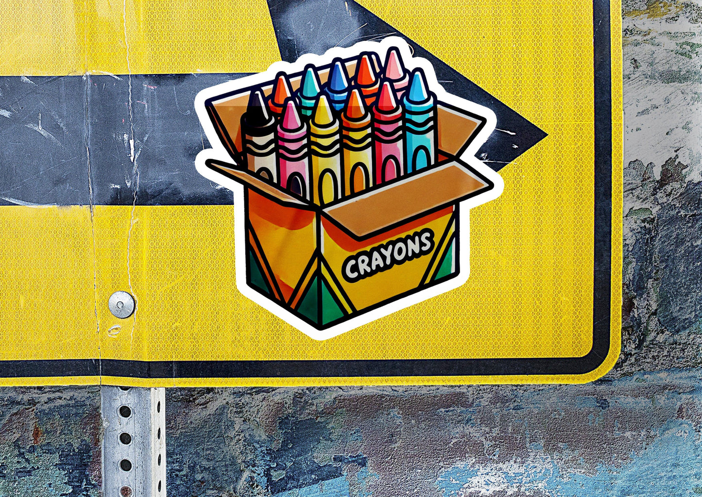 a close up of a street sign with a box of crayons on it