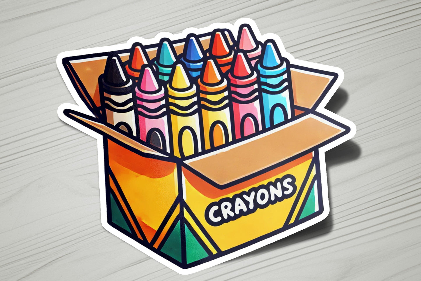 a box of crayons stickers on a table