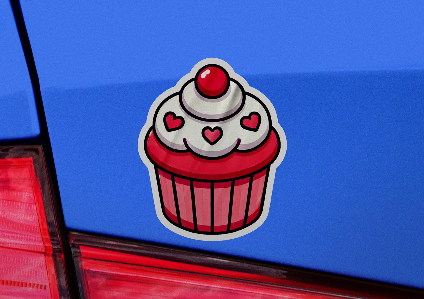 a cupcake sticker on the back of a car