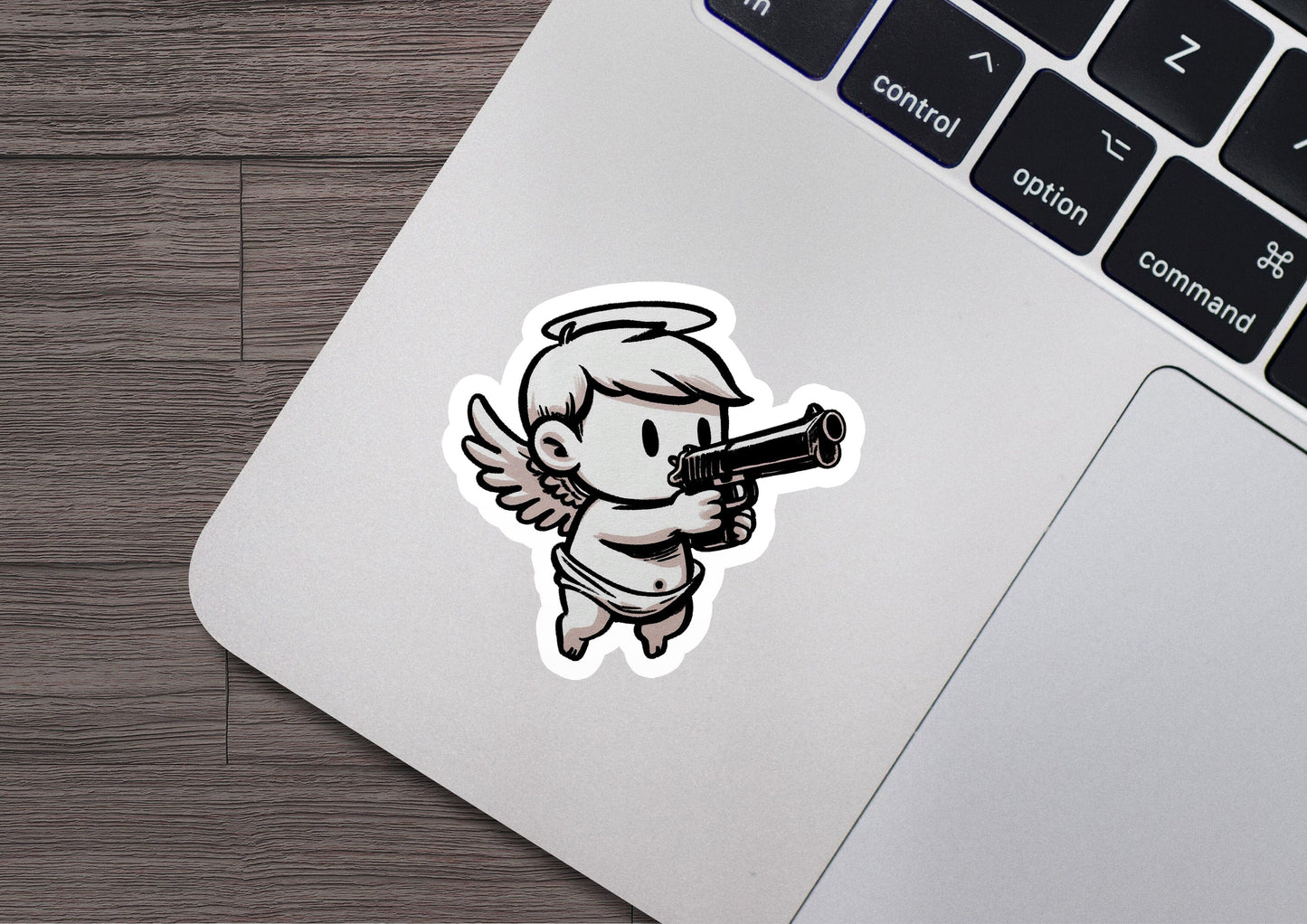 a sticker of an angel holding a gun