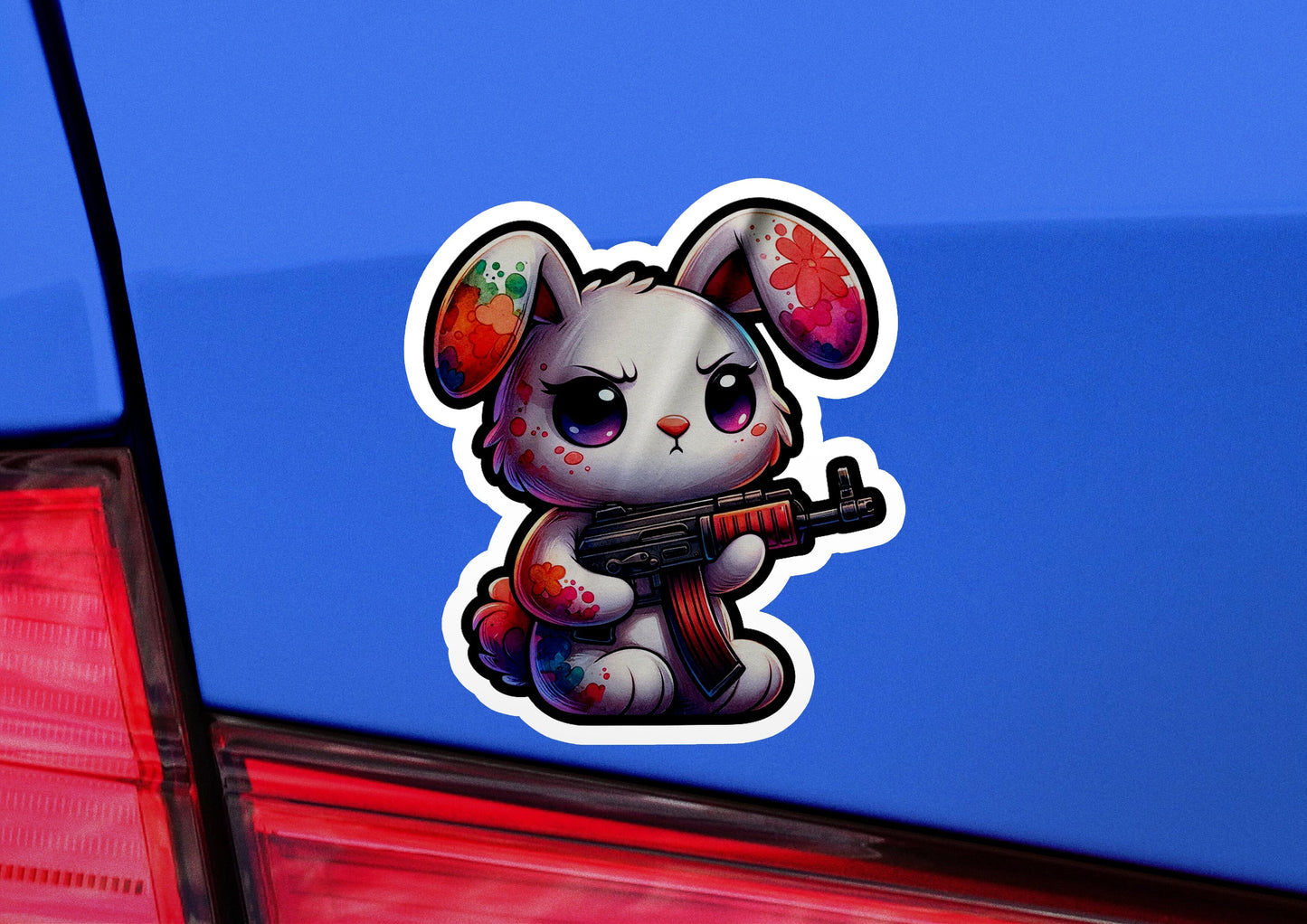 a sticker of a little bunny with a gun