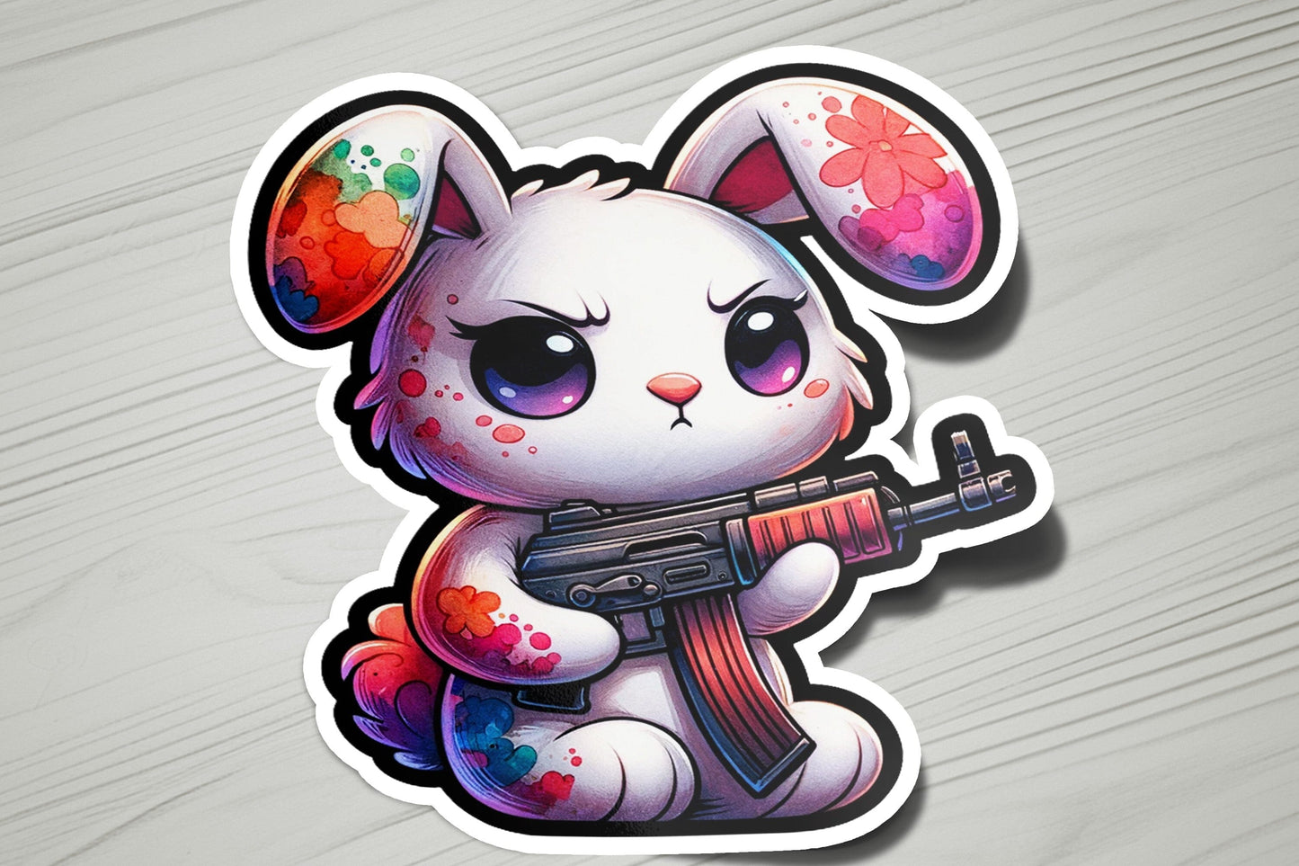 a sticker of a bunny with a gun
