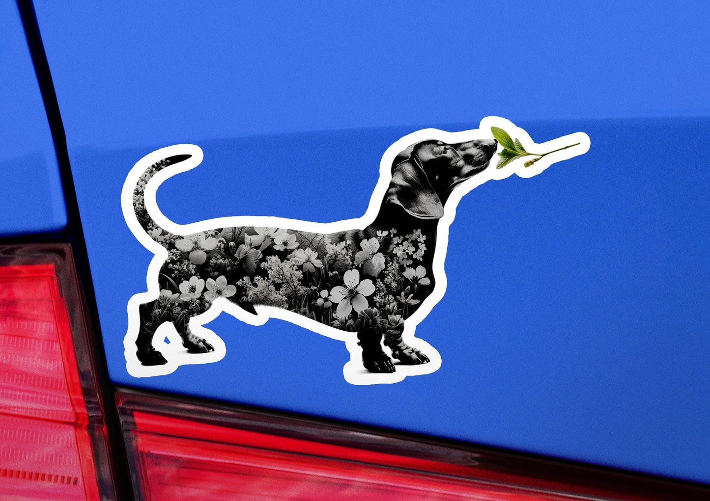 a sticker of a dog with a flower in its mouth