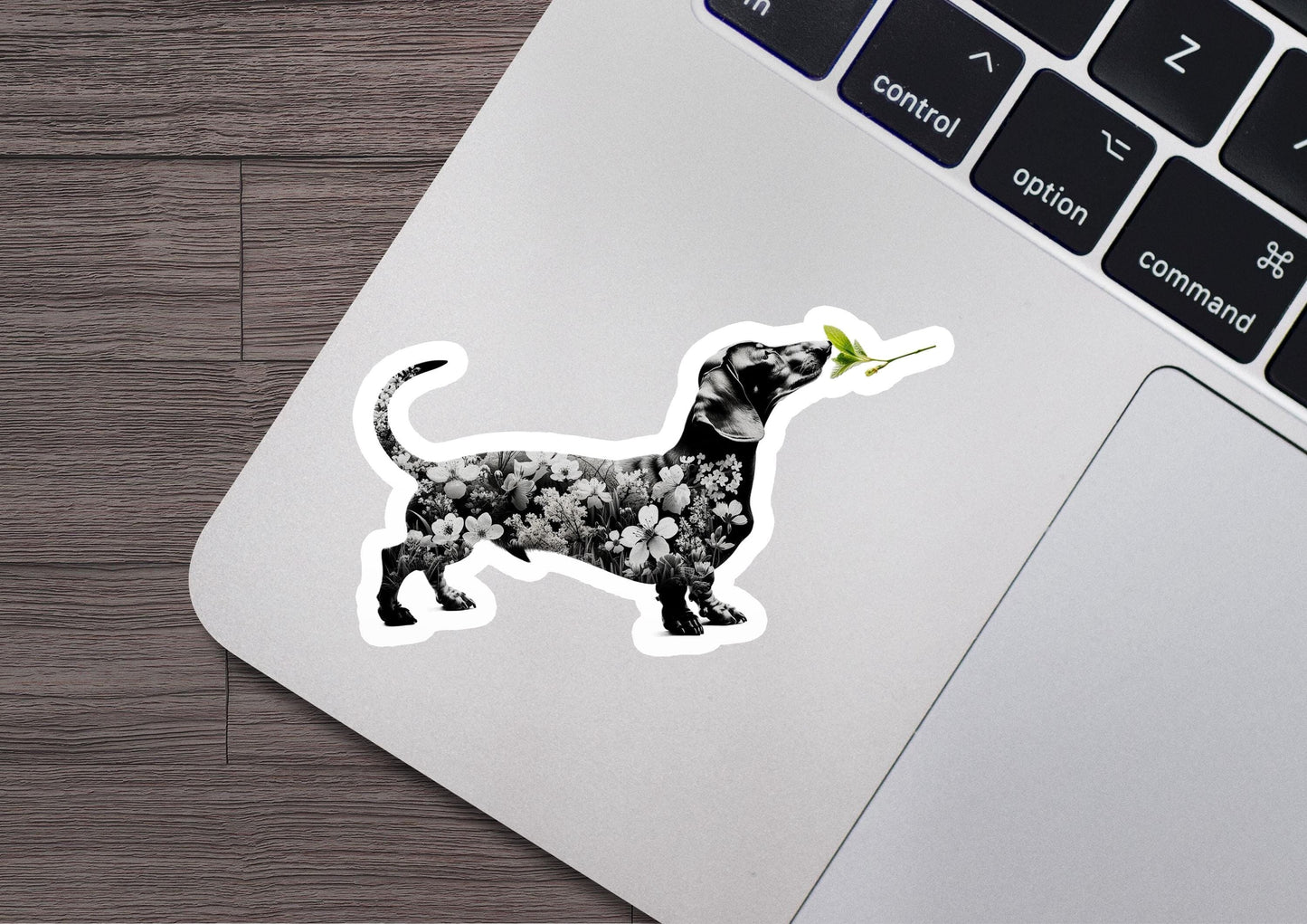 a sticker of a dog with a flower in its mouth
