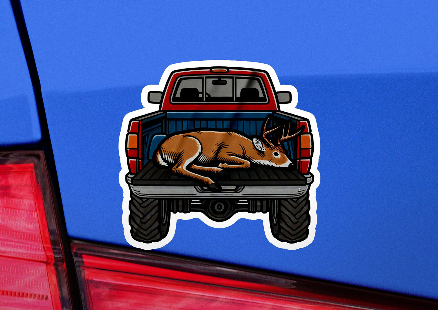 a sticker of a deer laying on the back of a truck