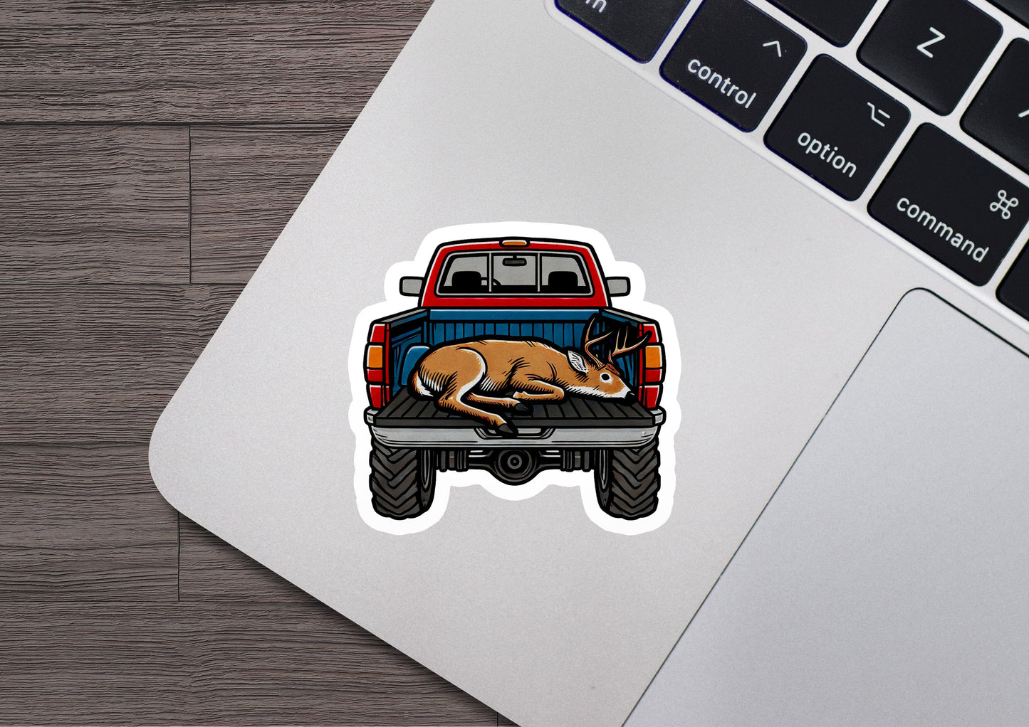 a sticker of a dog laying on the bed of a truck