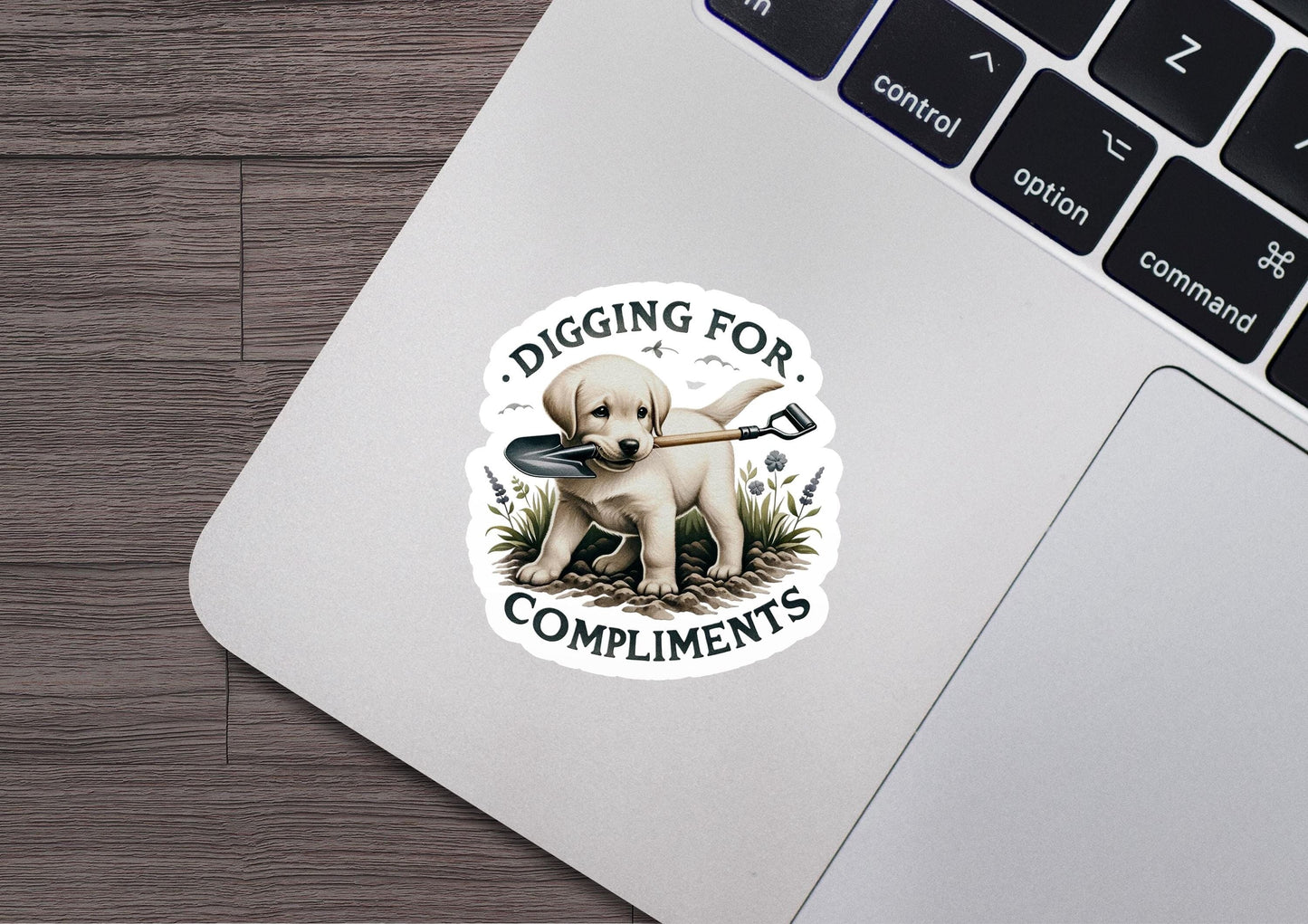 a sticker that says digging for compliments on a laptop