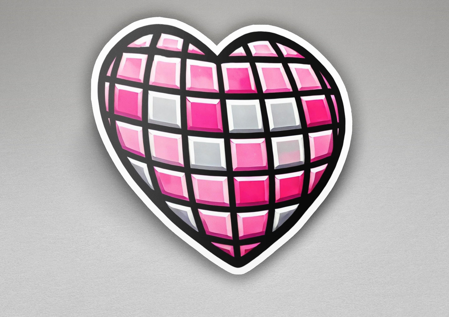 a heart shaped sticker with pink and grey squares