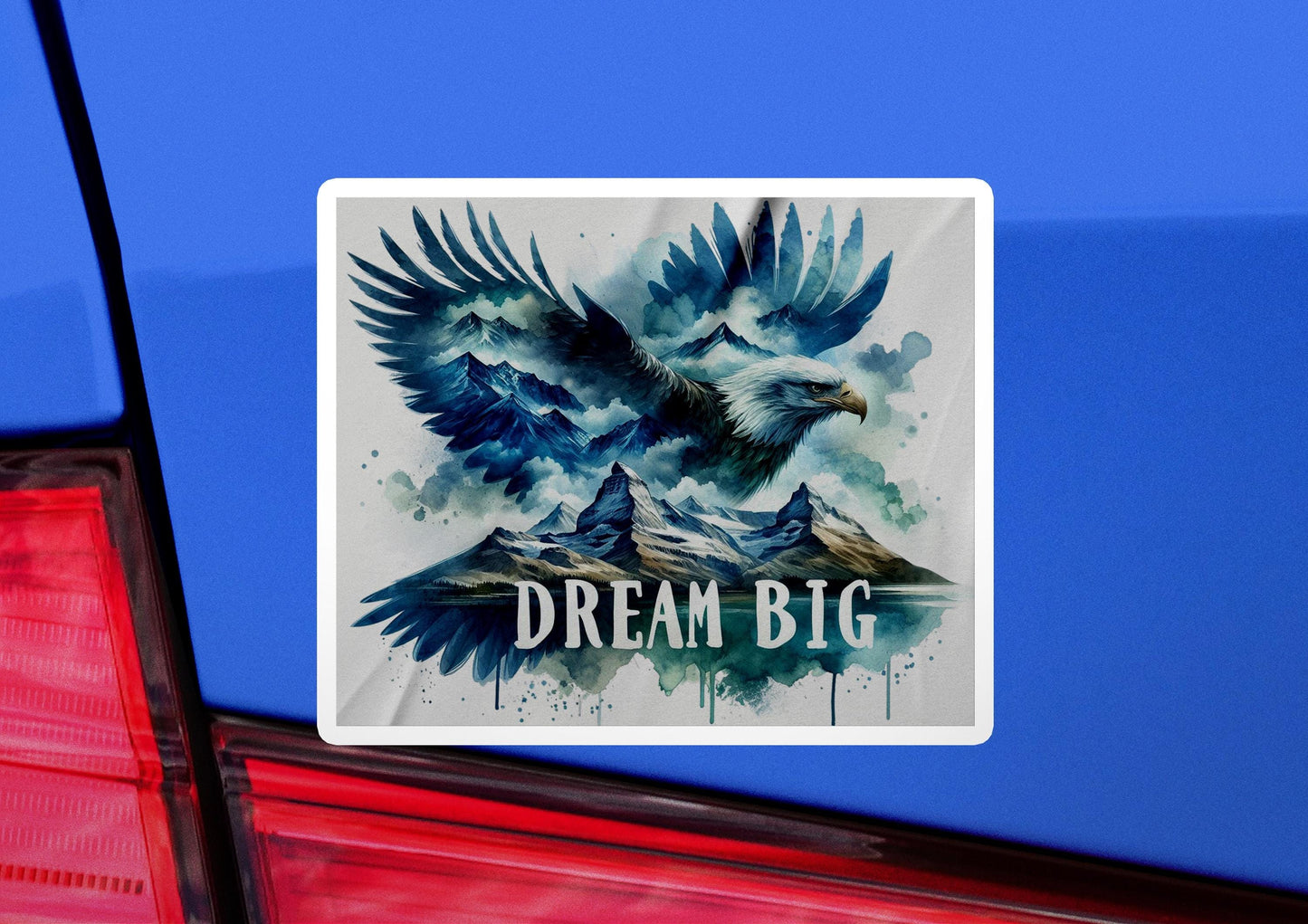 a sticker on the back of a car that says dream big