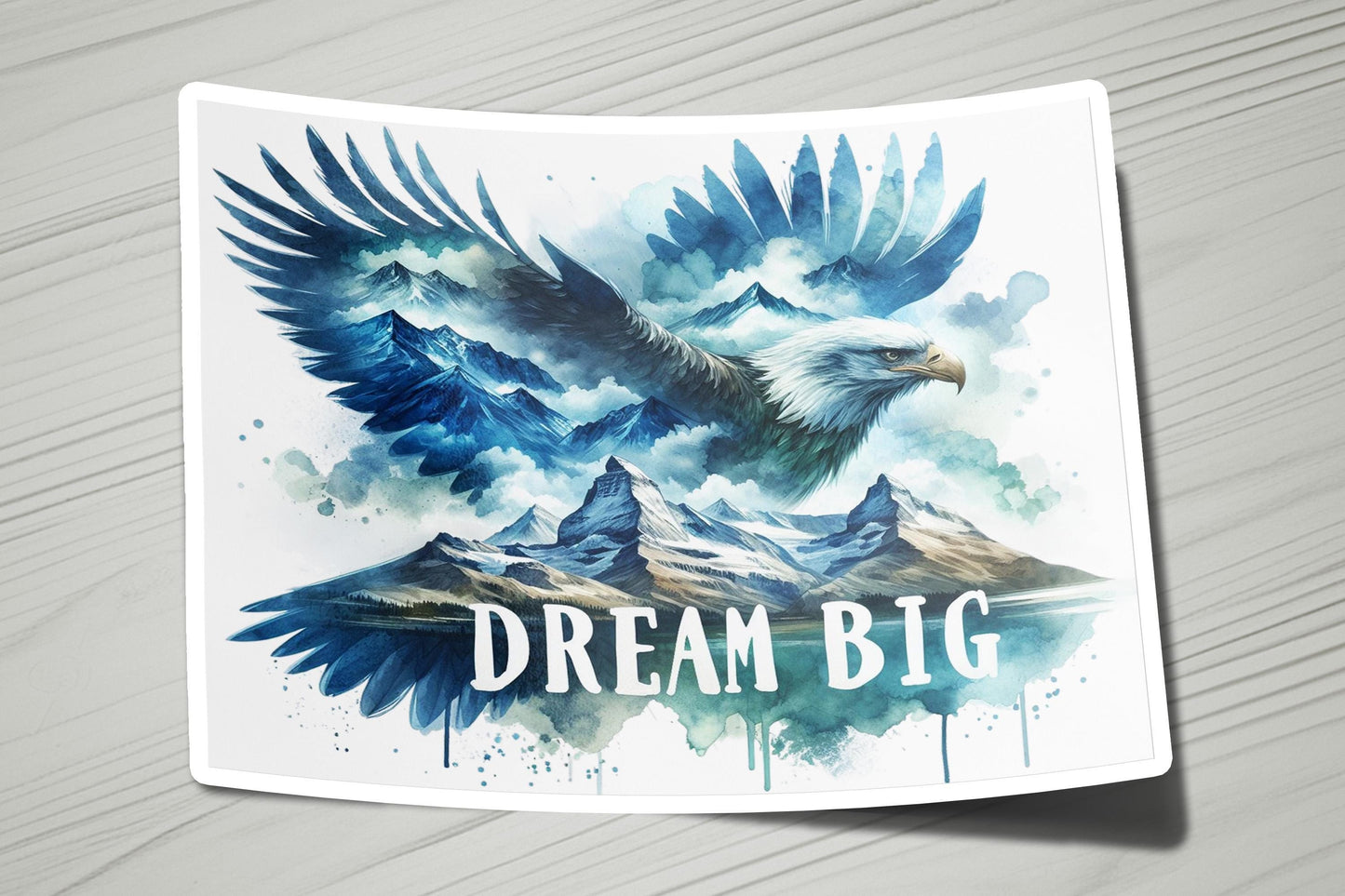 a sticker with a picture of an eagle flying over mountains