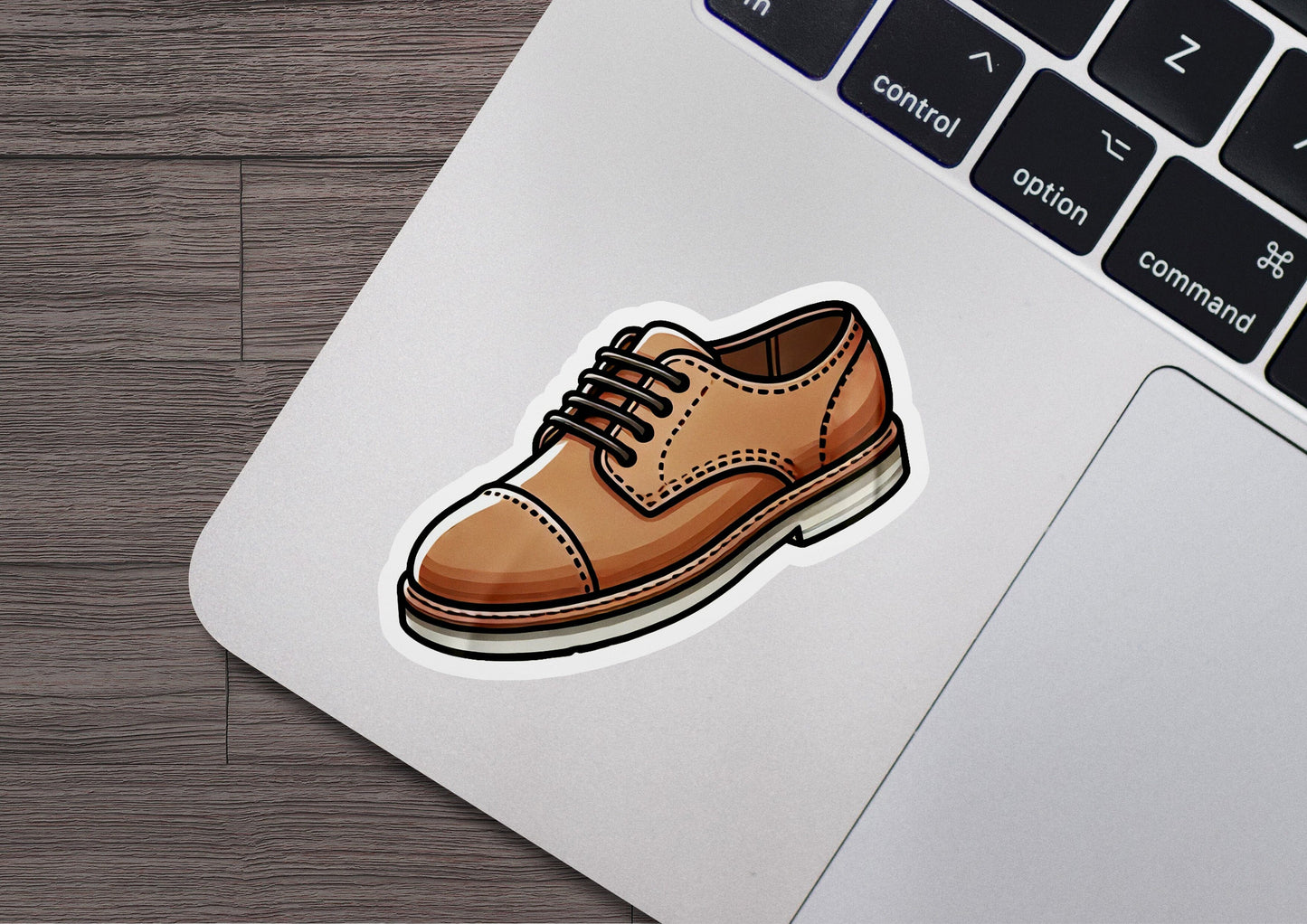 a sticker of a shoe on a laptop keyboard