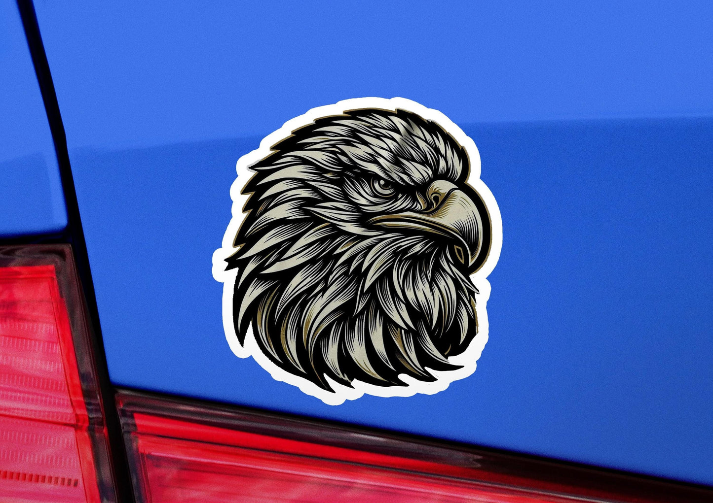 a sticker of an eagle head on the back of a car