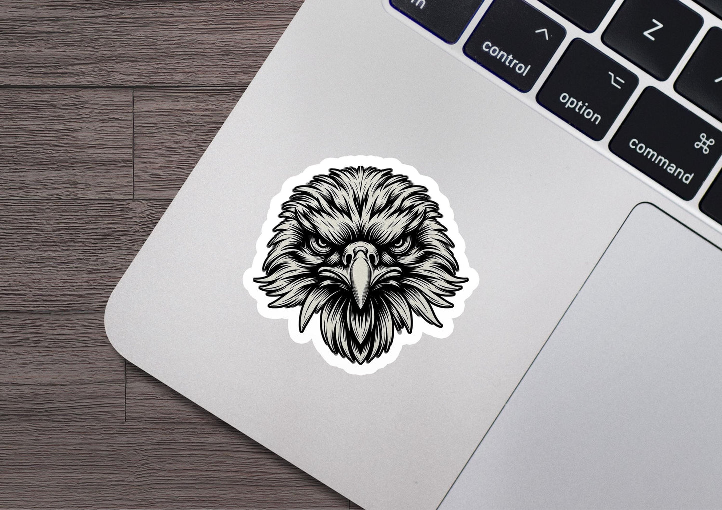 a sticker of an eagle head on a laptop