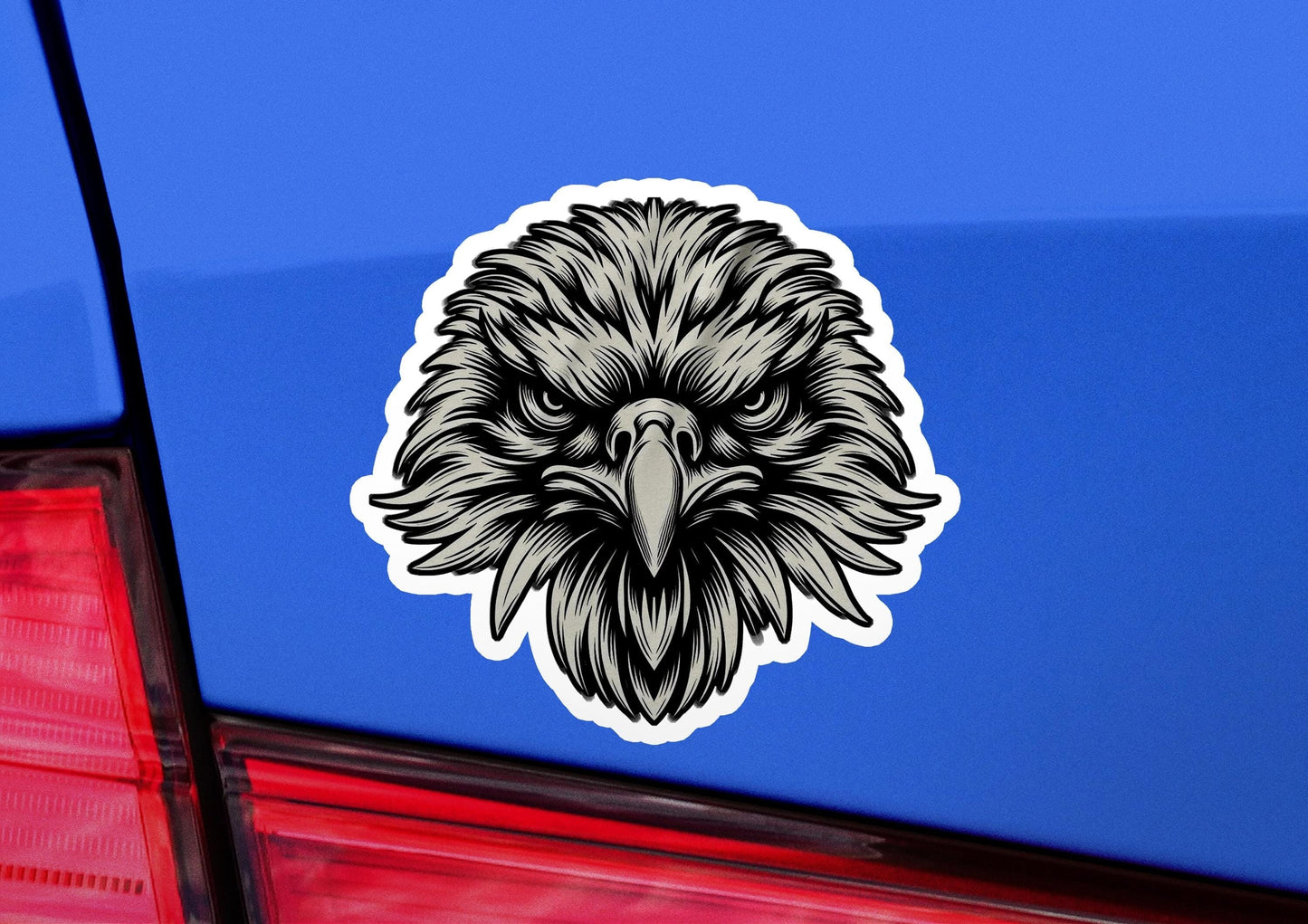 an eagle head sticker on the back of a car