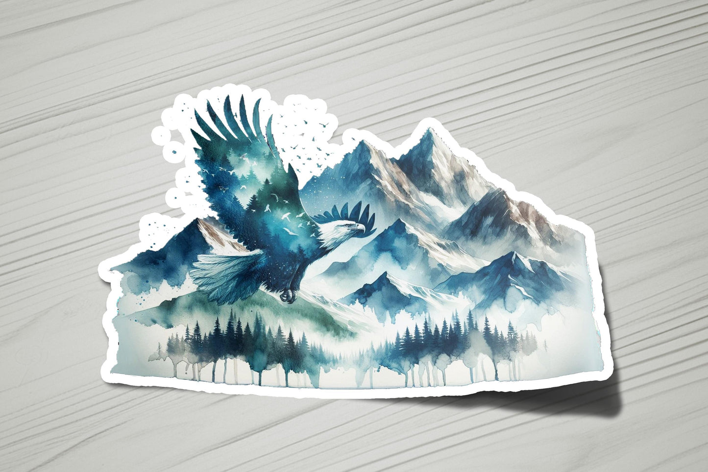 a sticker of a bird flying over a mountain range