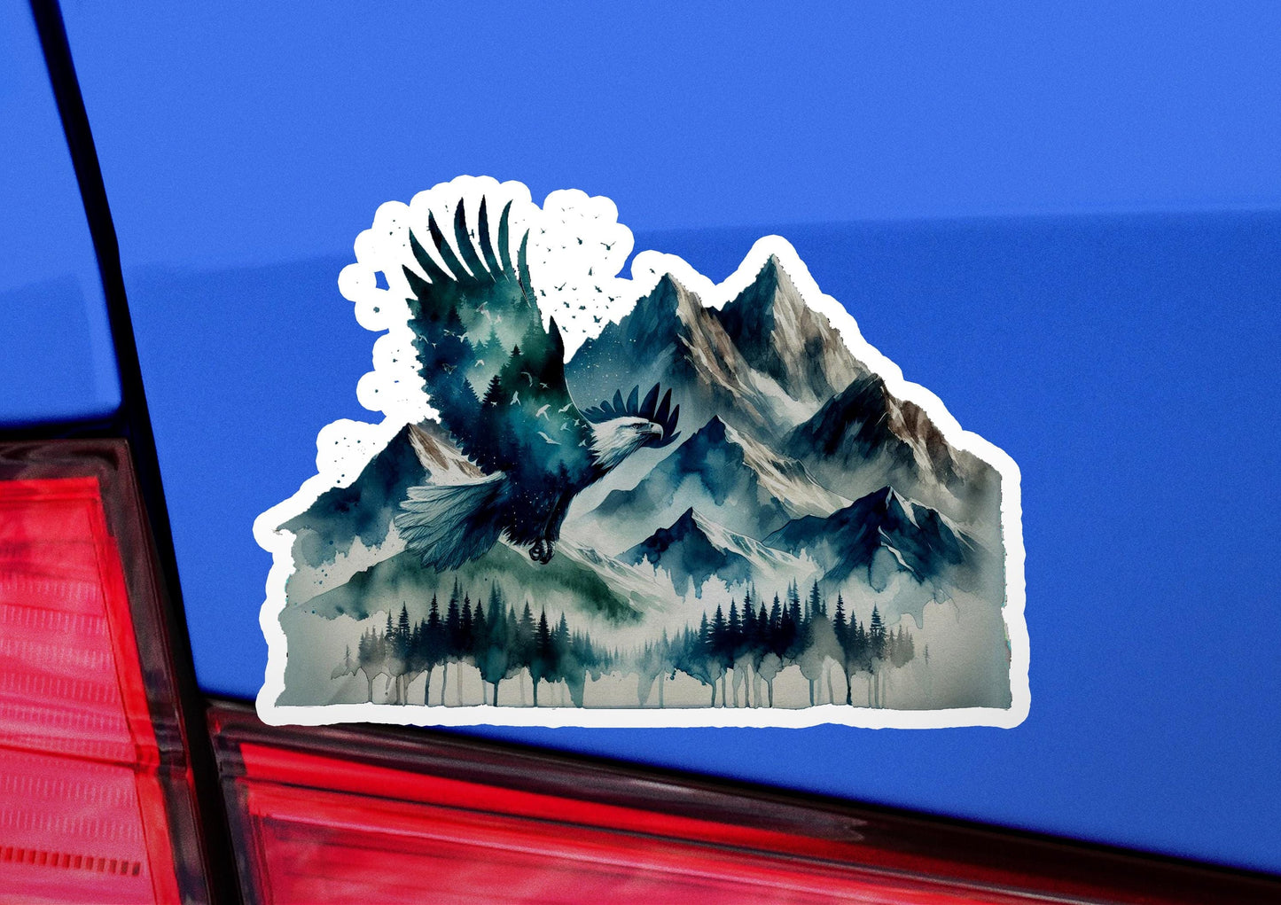 a sticker of a bird flying over a mountain range