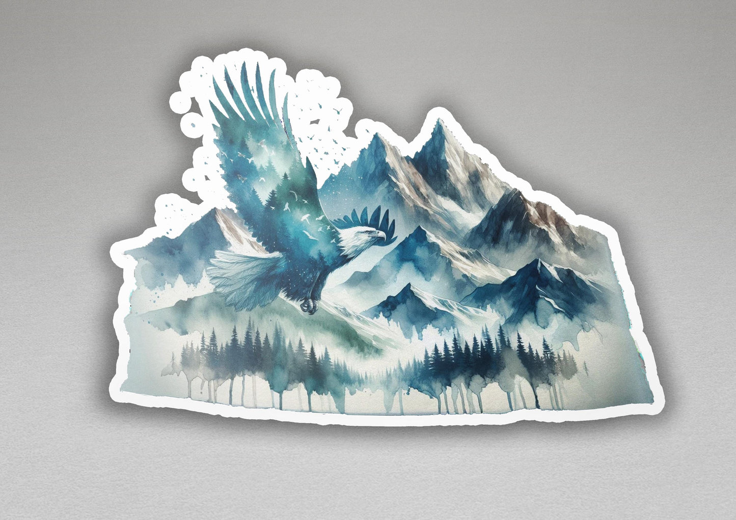 a sticker of a bird flying over a mountain range
