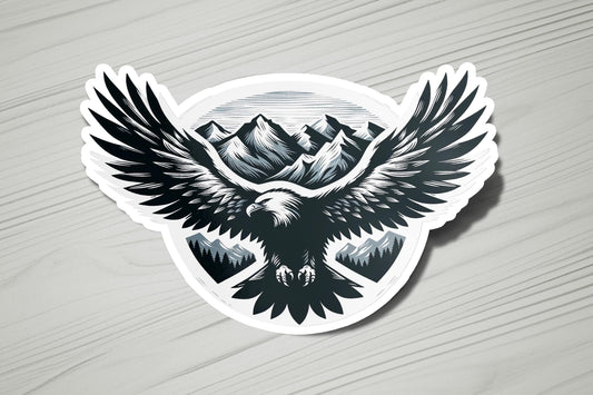 a sticker of an eagle with mountains in the background