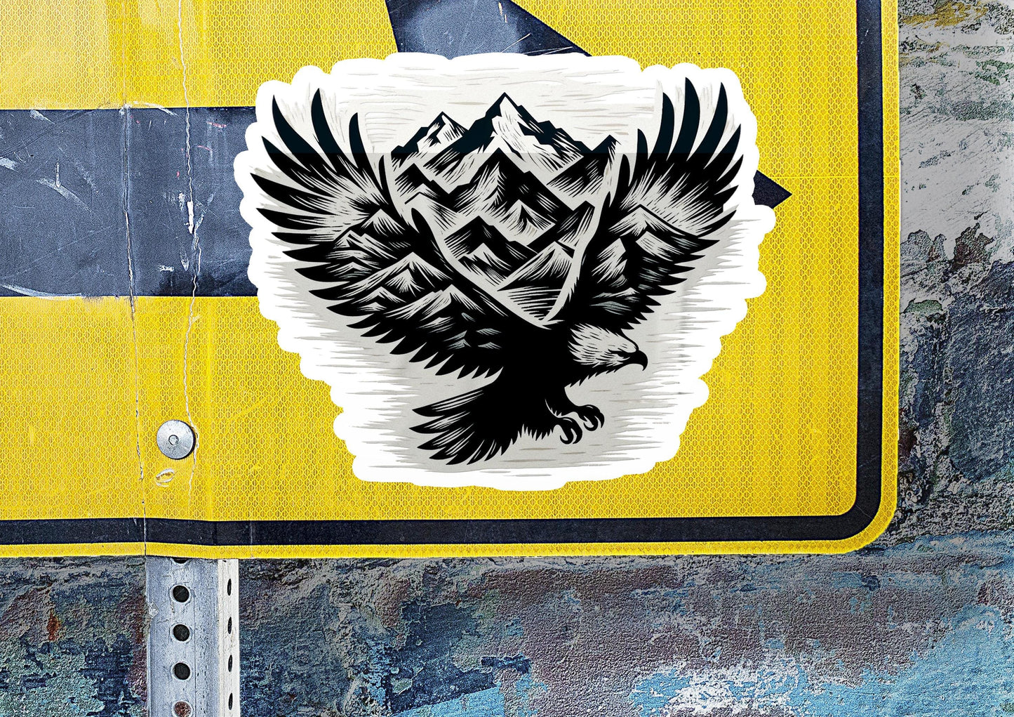 a sticker of an eagle with mountains in the background