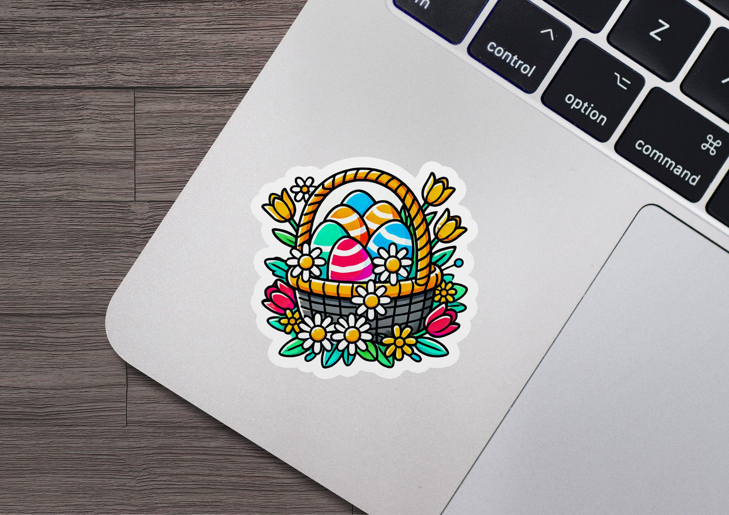 a laptop with a sticker of an easter basket