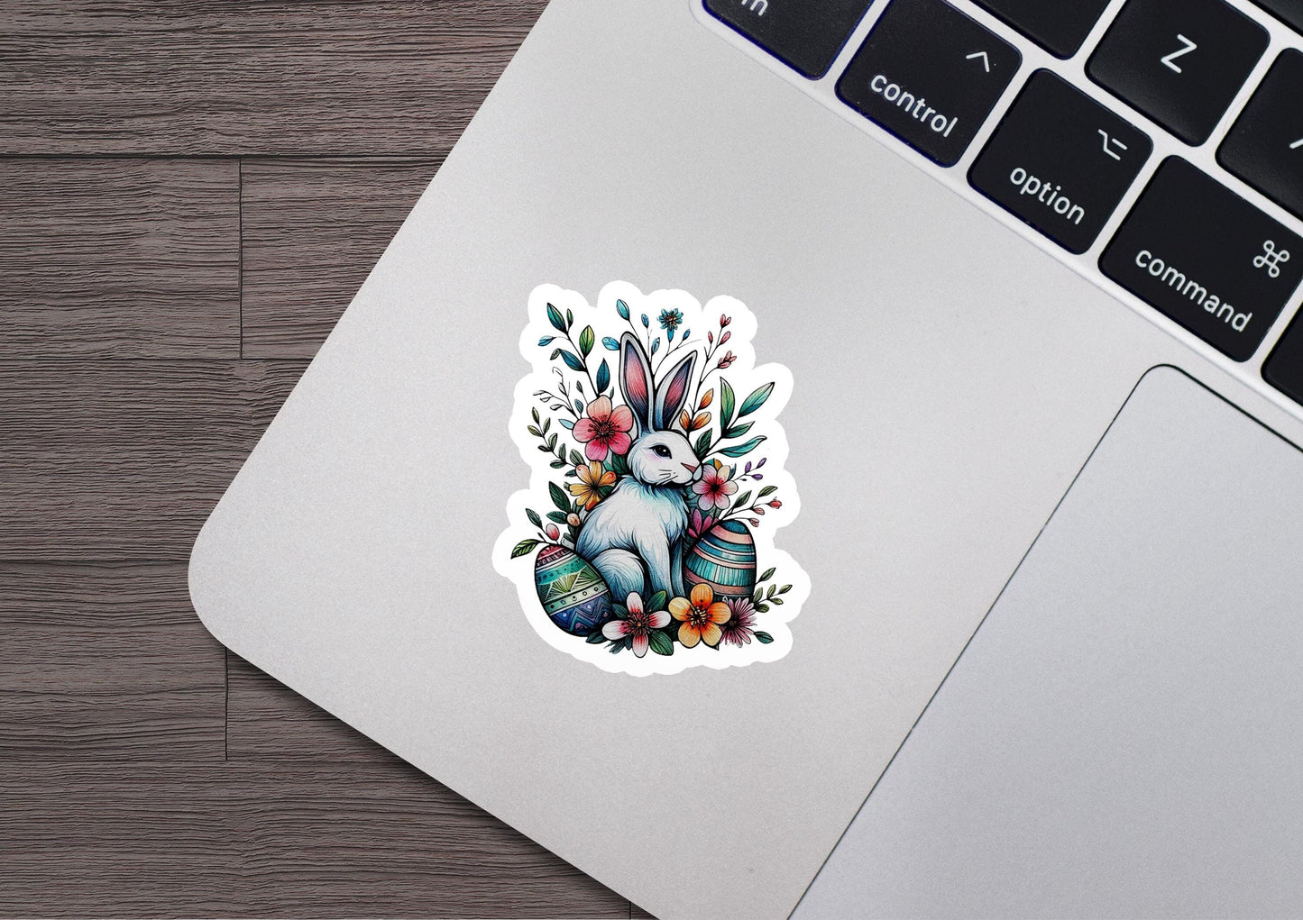 a laptop computer with a sticker of a rabbit on it
