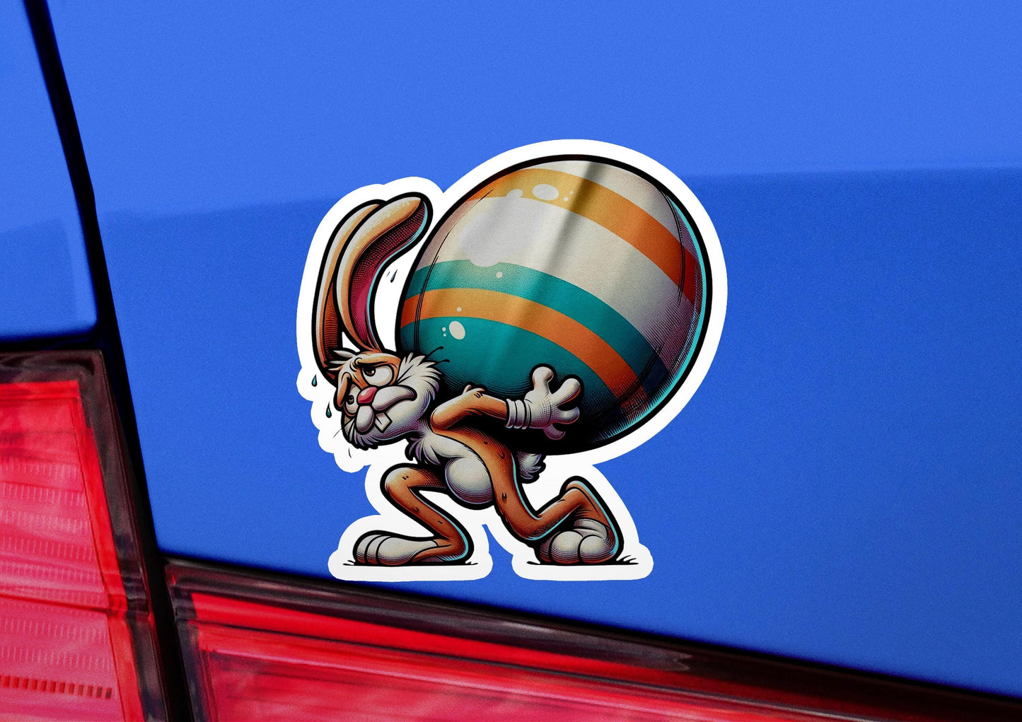a sticker of a rabbit carrying a large ball