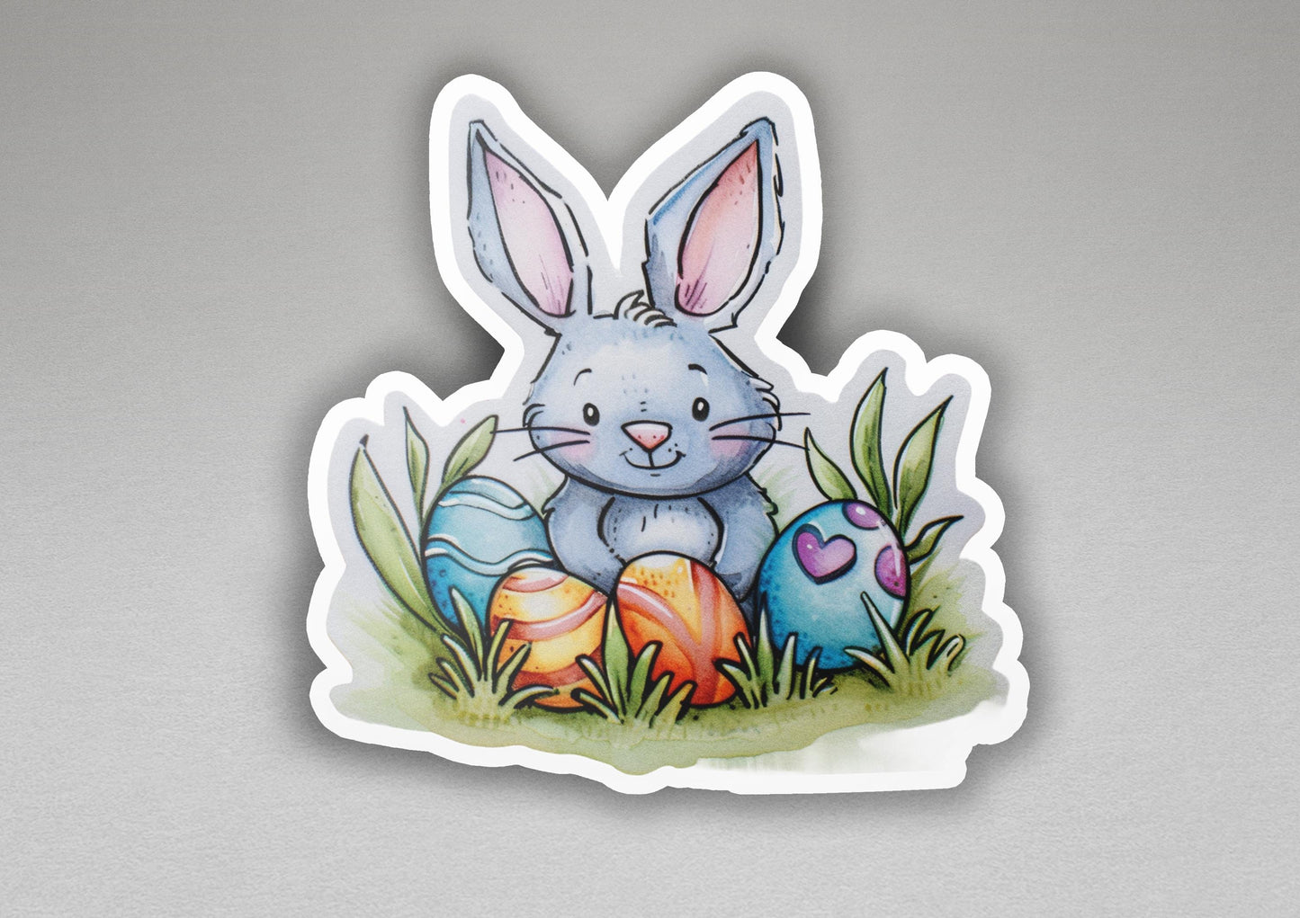 a sticker of a bunny sitting in the grass