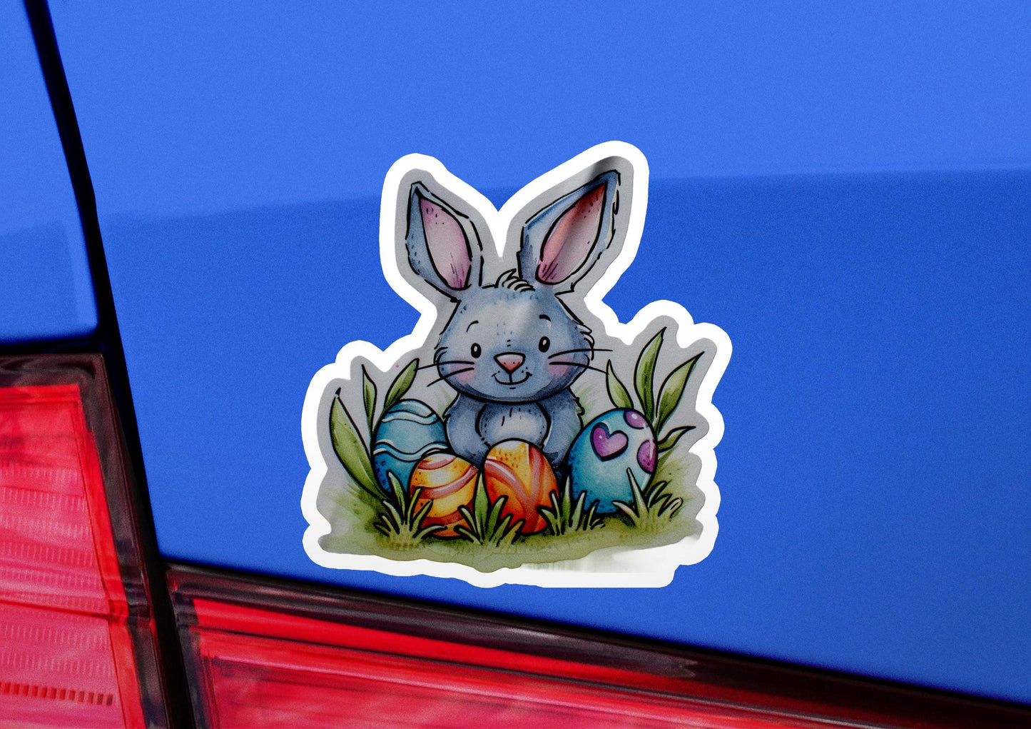 a sticker of a rabbit sitting in the grass