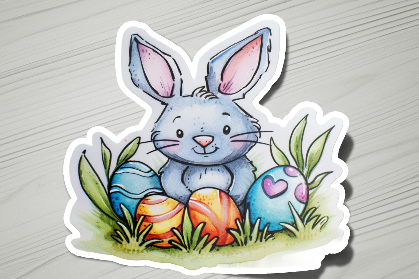 a sticker of a bunny sitting in the grass