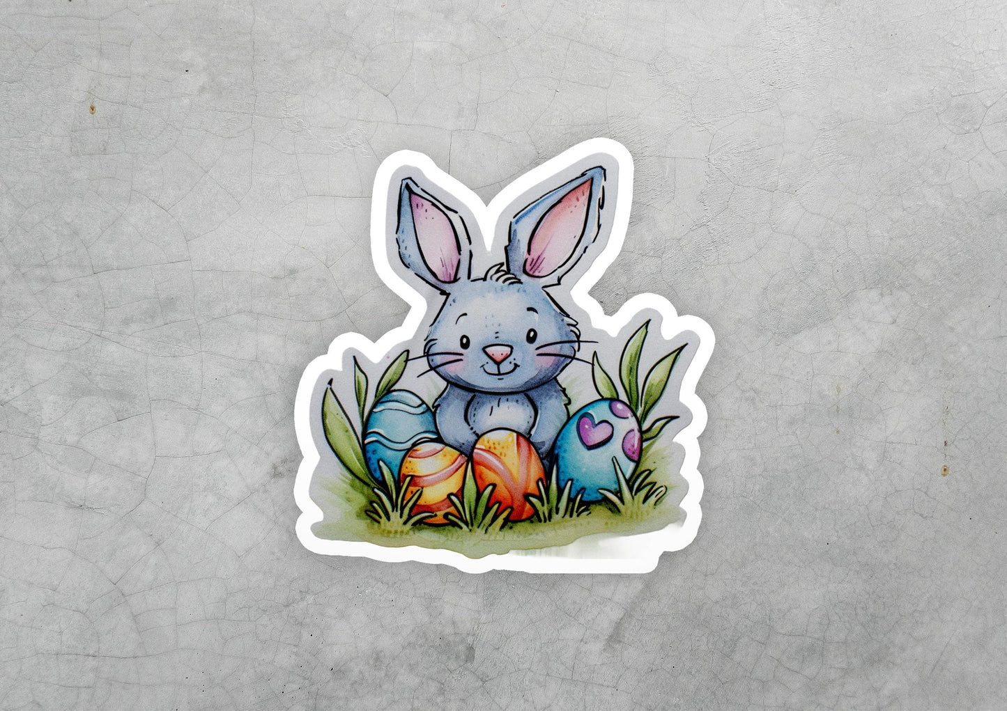 a sticker of a rabbit sitting in the grass