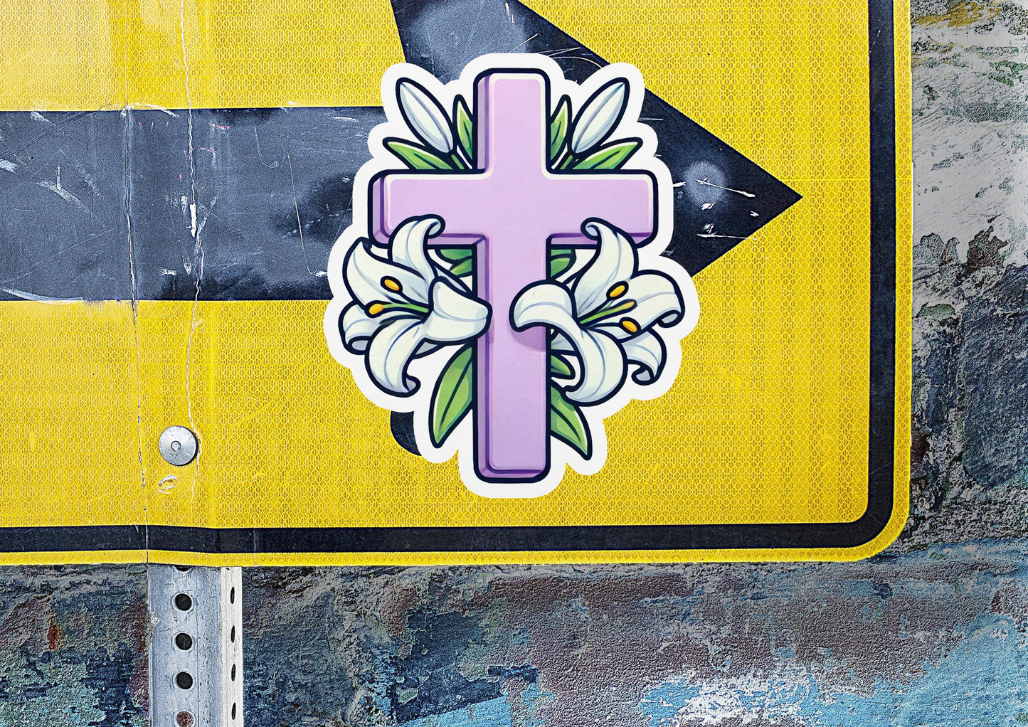 a street sign with a cross and flowers on it