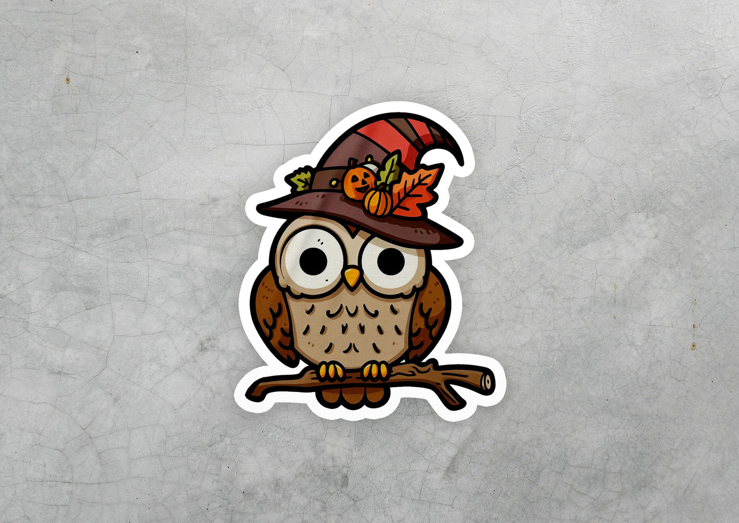 a sticker of an owl wearing a hat and holding a branch
