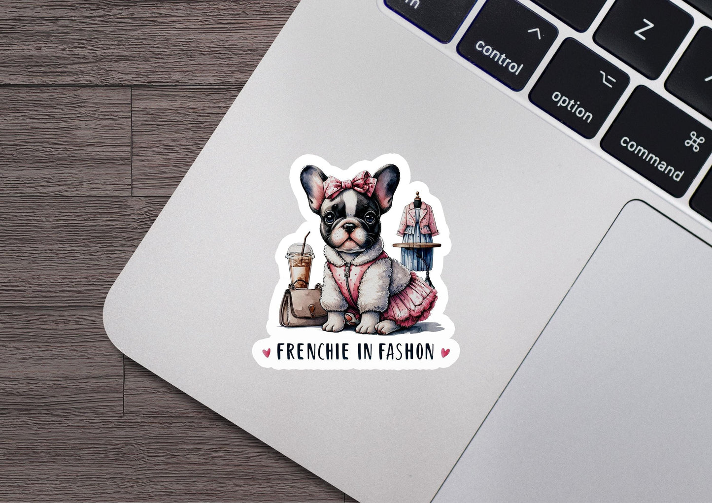 a laptop with a sticker of a french bulldog