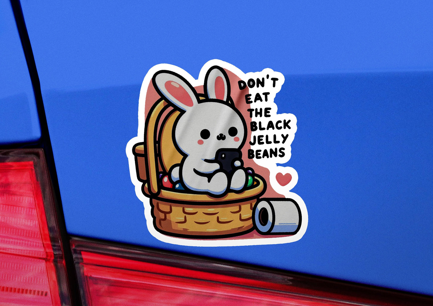 a sticker of a rabbit in a basket on the back of a car