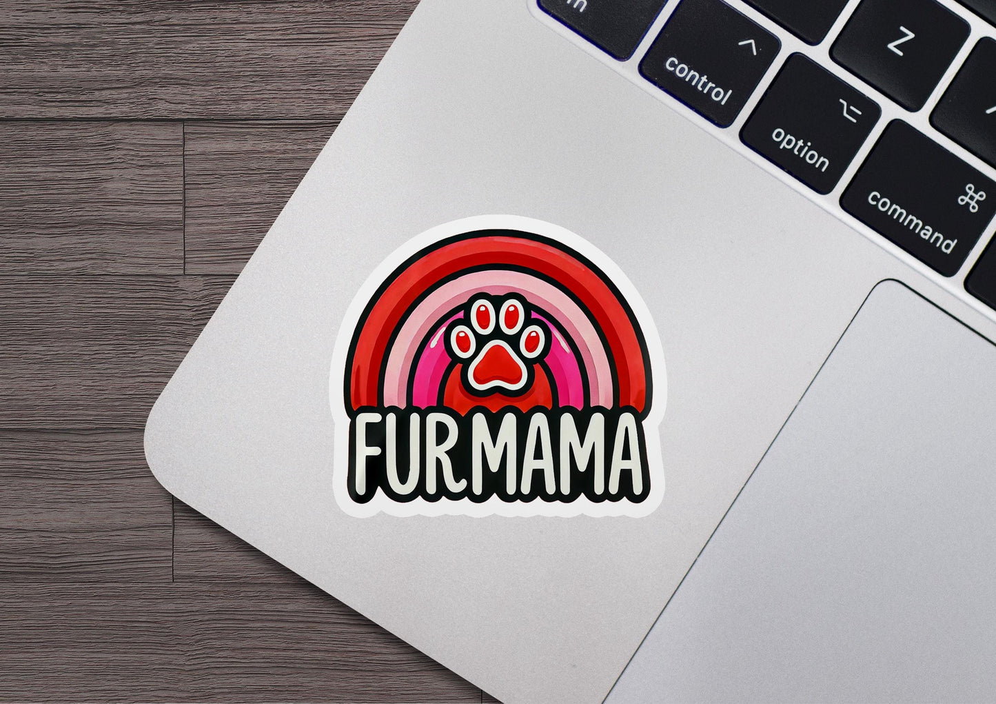 a laptop with a sticker of a paw on it