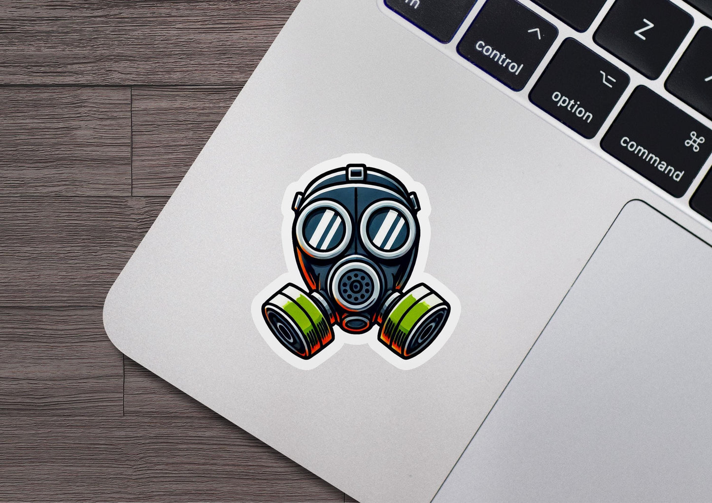 a laptop with a sticker of a gas mask on it