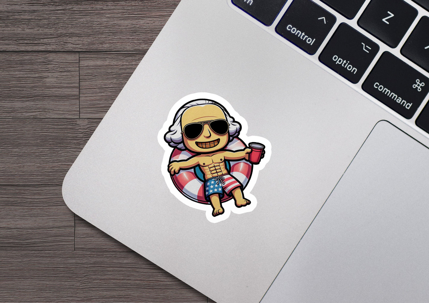 a laptop with a sticker of a cartoon character