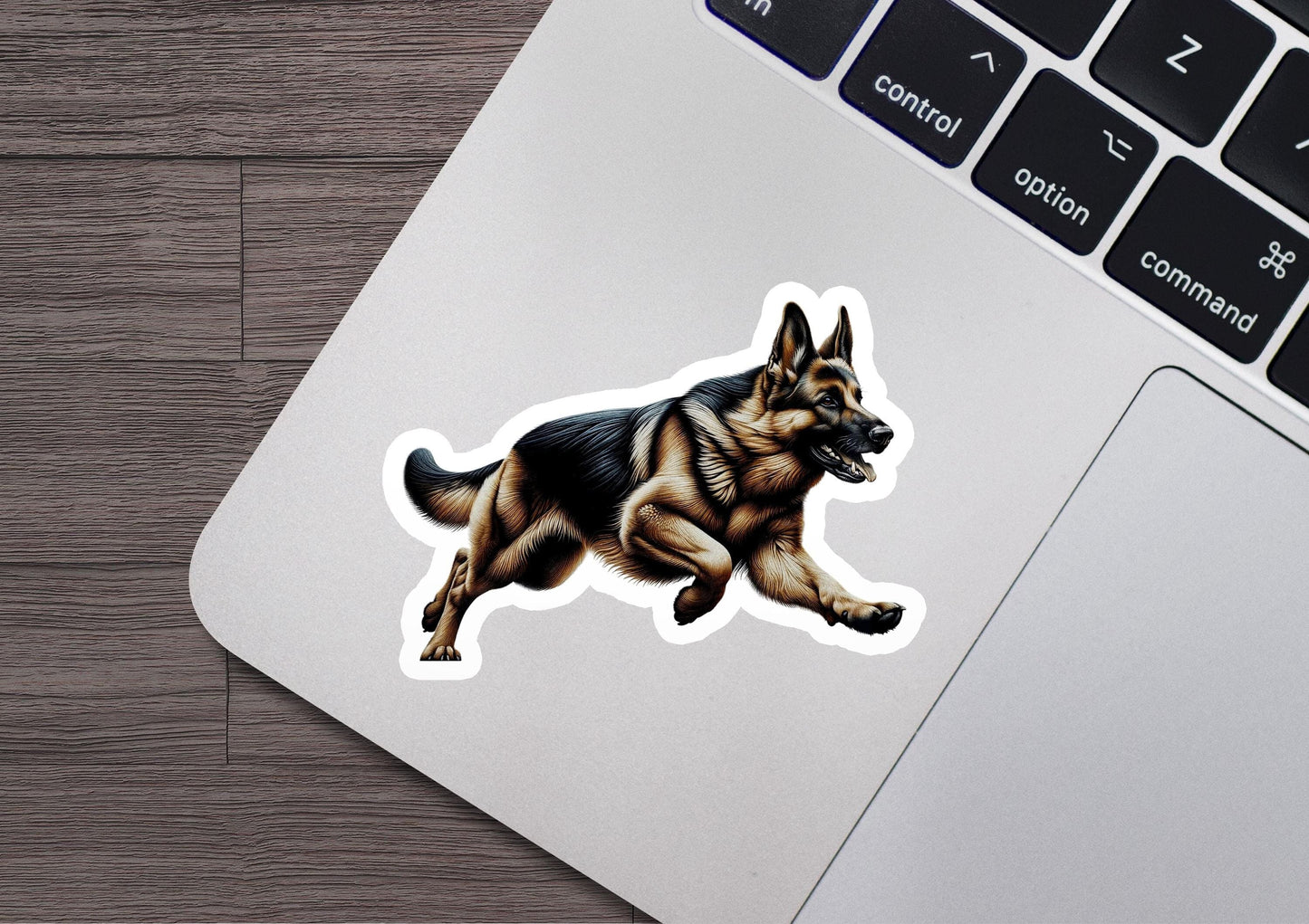 a laptop with a sticker of a dog running