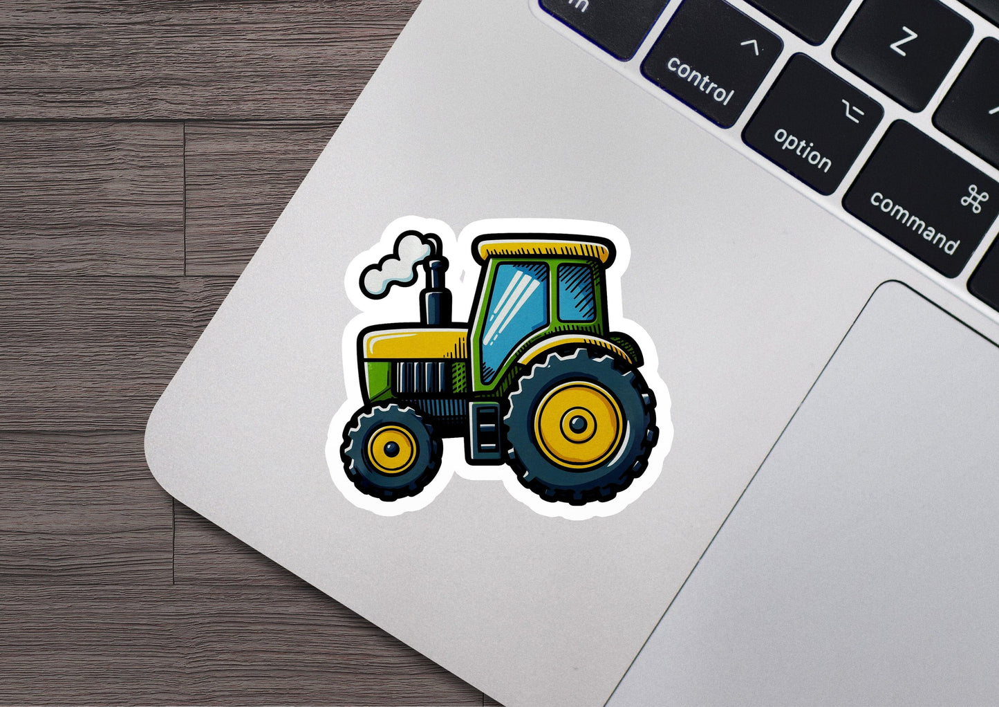 a sticker of a tractor on a laptop
